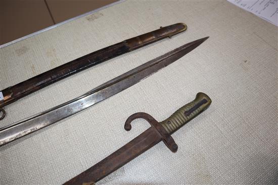 Two officers swords and a bayonet